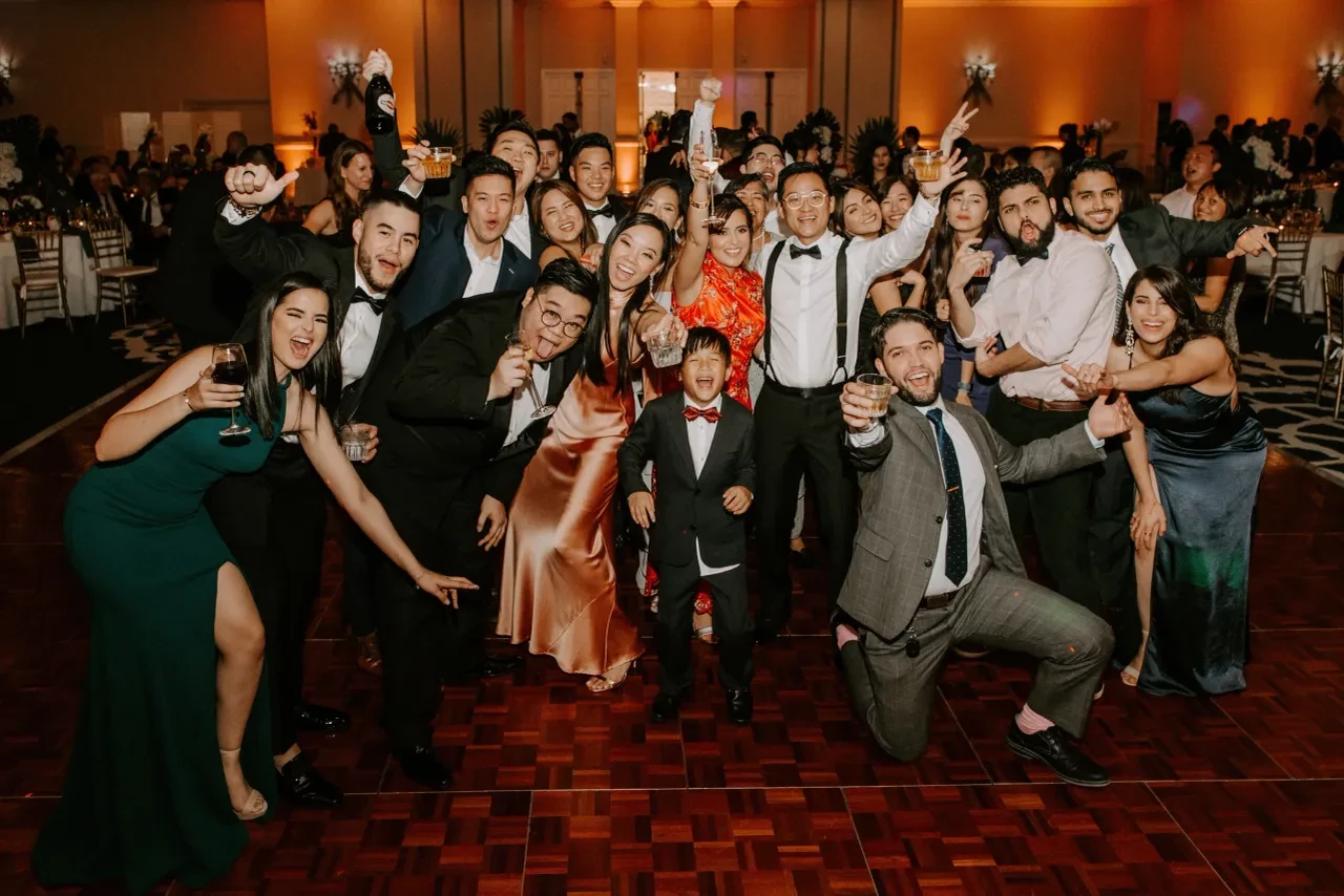 Wedding guests celebrating on the dance floor